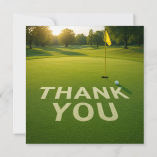 Golf  ball with word thank you on putting green