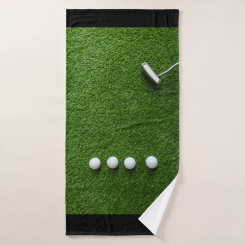 Golf balls are on green grass for golfer  bath towel