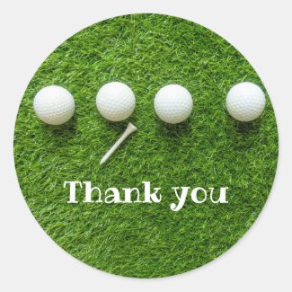 Golf balls are on green grass thank you classic round sticker