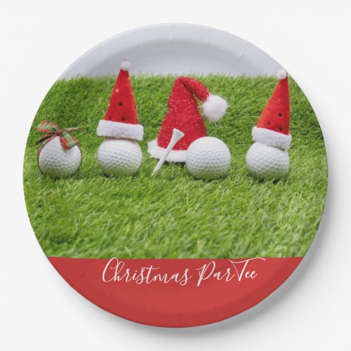 Golf balls with Santa hats Christmas are on green Paper Plates