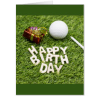 Golf birthday with present and golf ball on green card