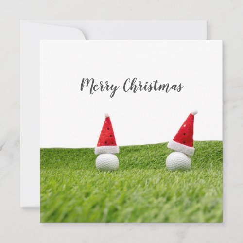 Golf Christmas card with Santa hat on green