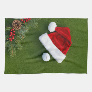 Golf Christmas themed on green grass Kitchen Towel