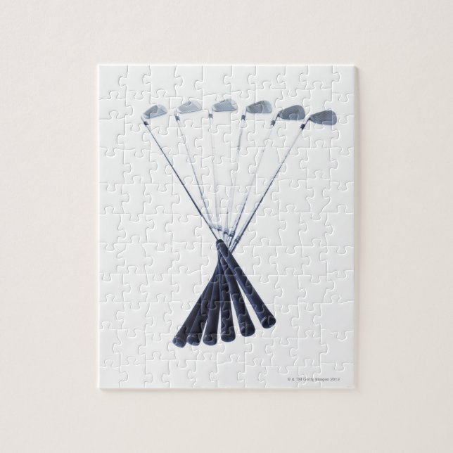 Golf clubs on white background jigsaw puzzle (Vertical)