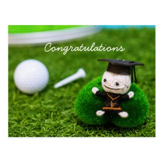 Golf graduation with golf ball and tee on green postcard