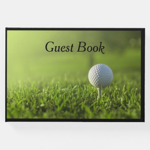 Golf Guest book with golf ball on tee on green 