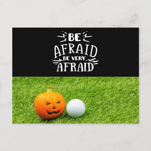Golf Halloween with golf ball and pumpkin on green Postcard