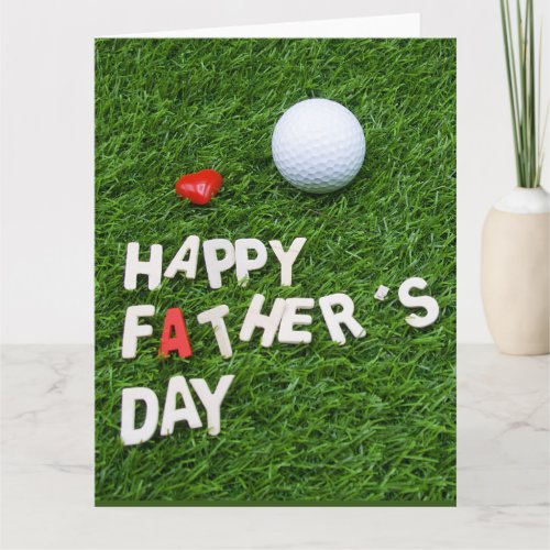 Golf Happy Fathers Day with tee and ball on green Card