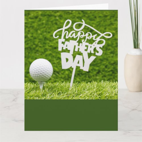 Golf Happy Fathers Day with tee and ball on green Card