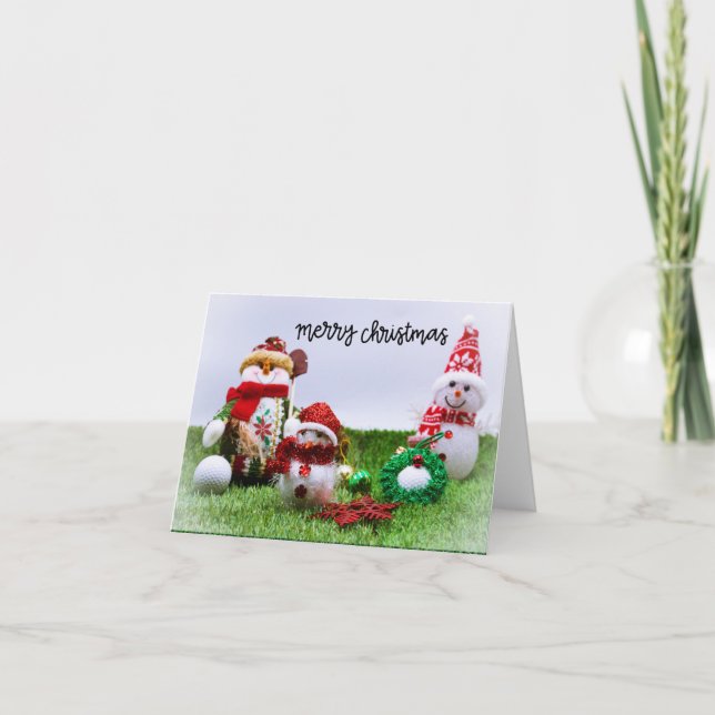 Golf Merry Christmas with Snowman on green grass Holiday Card (Front)