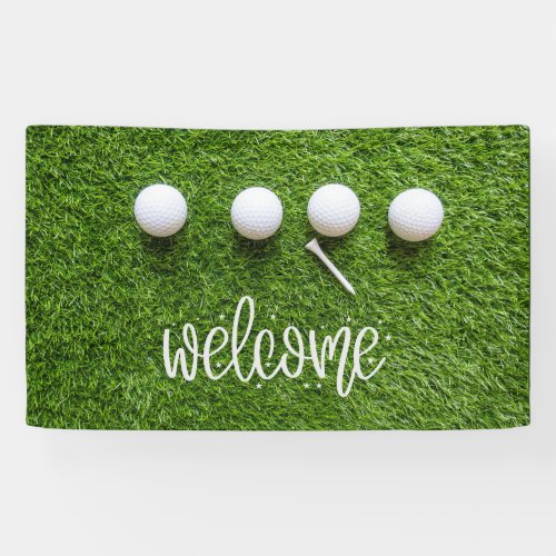 Golf welcome sign with golf ball on green grass