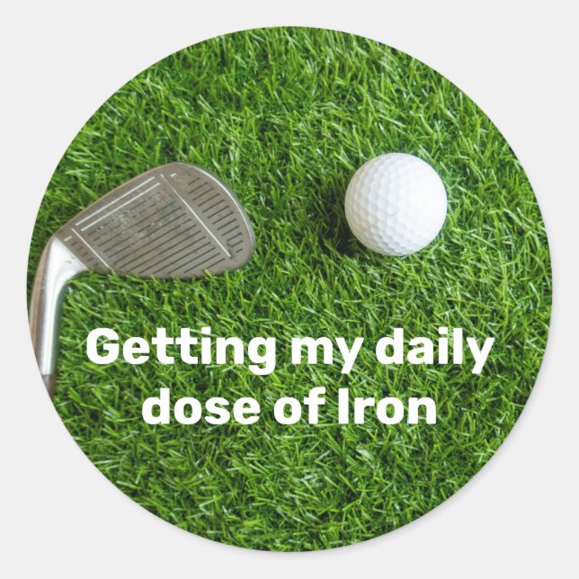 Golfer getting dose of iron and golf ball on green classic round sticker (Front)