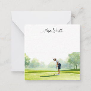 Golfer Woman is on green grass in golf course Note Card