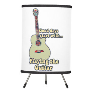 Good days start with playing the guitar. vintage tripod lamp