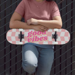 Good Vibes Girly Pastel Pink White Checker Pattern Skateboard<br><div class="desc">Another girly skateboard by JessicaAmber - message me about custom orders! This fun skateboard features a pastel pink and white checkerboard design. The pattern has a wavy distortion to it, giving a fun and youthful vibe. The slogan in the middle says 'good vibes' in a chunky retro font with a...</div>