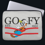 Goofy Est. 1932 Laptop Sleeve<br><div class="desc">Celebrate a legacy of laughter with this classic "Goofy Est. 1932" heritage design! Blending timeless collegiate-style typography with dynamic Goofy character art, this graphic captures a moment of pure, clumsy joy. The bold black serif lettering is accented by vibrant red racing stripes, giving the piece an athletic, vintage-sportswear feel. The...</div>
