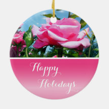 Gorgeous pink rose in blue sky. Happy holidays