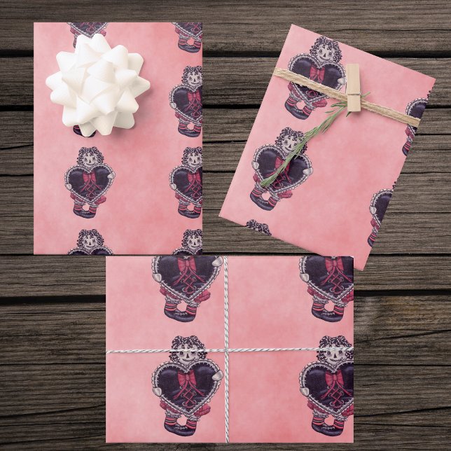 Gothic Cloth Dolls Big black Heart Bow Pinks Wrapping Paper Sheets (Gothic rag doll holding black heart with red bow trimmed in lace on mix of pink gift wrapping papers)