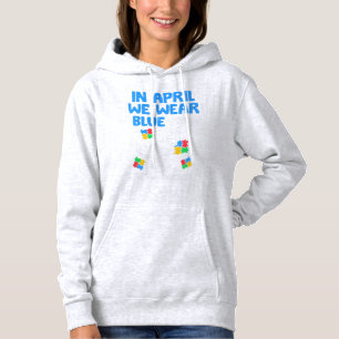 Grab this funny In April We Wear Blue Dinosaur Hol Hoodie
