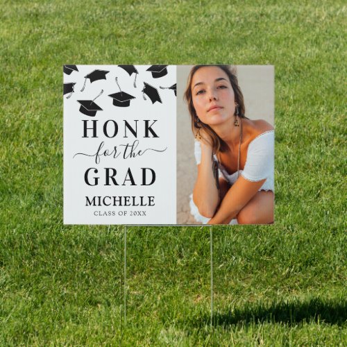 Graduation Honk for the Grad Photo Yard Sign - Simple graduation yard sign featuring a minimalist white background that can be changed to any color, falling black mortarboard caps, a photo of the graduate, the saying "honk for the grad", their name, and the year.