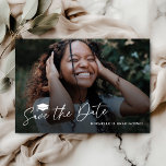 Graduation Party Save The Date Card<br><div class="desc">Capture your graduation moment with our sophisticated 'Save the Date' cards, reflecting a perfect blend of charm and simplicity. Adorned with a printed photograph of the graduate set against a dusty dark overlay, these cards are a statement of elegance. The classy script font, accompanied by a grad cap symbol, adds...</div>