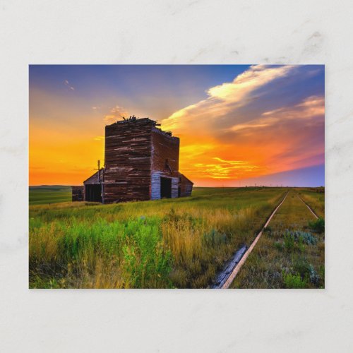 Grain Elevator and Railroad Tracks Postcard