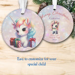 Granddaughter Baby Unicorn with Christmas Gifts Ornament<br><div class="desc">Here's a cute Christmas ornament for that special granddaughter, daughter, or niece! A baby white unicorn with pastel colored mane has brought several gifts decorated with ribbons and bows. The image is placed on a pink and lavender bokeh background. The back of the ornament has the same bokeh background with...</div>