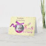 Granddaughter first birthday photo card<br><div class="desc">pink ribbon and bow frame with photo of your granddaughter on soft yellow and confetti background for 1st birthday</div>