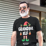 Grandpa elf family matching christmas outfit funny T-Shirt<br><div class="desc">Get into the holiday spirit with this fun “Grandpa Elf” t-shirt, part of a coordinated family elf outfit collection perfect for Christmas celebrations and festive family photos. This cheerful holiday tee features a red elf hat, cute elf legs, and the bold all-caps caption “Grandpa Elf” in a clean modern white...</div>