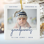 Grandparents 1st Christmas Photo Minimalist Blue Ceramic Ornament<br><div class="desc">Help them celebrate the arrival of their first grandchild with this modern minimalist photo keepsake ornament. The navy blue text reads "Our first Christmas as grandparents, " with the word "grandparents" in trendy handwriting script. Easily replace the sample image with your favorite photo of the new baby, and add his...</div>