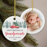 Grandparents First Christmas Photo Ceramic Ornament<br><div class="desc">Rustic watercolor first christmas photo ornament featuring a simple white background,  watercolor spruce trees,  a vintage red truck,  the words "first christmas as grandparents",  the names of grandma & grandpa,  and the year. On the reverse is a treasured picture of the grandchild.</div>