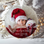 Grandparents First Christmas Photo White Script Ornament<br><div class="desc">Help them celebrate their first grandchild with this beautiful modern keepsake ornament. The white text reads "Our first Christmas as grandparents, " with the word "grandparents" in elegant handwriting script with flourishes before and after. Easily replace the sample image with your favorite photo of the new baby, and add his...</div>