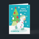 Grandson Christmas Snowman Ice Skating Holiday Card<br><div class="desc">A super cute and colorful Christmas card for a young Grandson with an adorable snowman ice skating on a small pond and a colorful three tiered Christmas tree with snowflakes sprinkled on a turquoise background. Snowman courtesy of PrettyGrafik.</div>