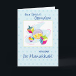 Grandson First Hanukkah Holiday Card<br><div class="desc">This colorful design on a white and blue background is perfect for a baby boy. Gold coins and toys to wish your Grandson a very happy First Hanukkah.</div>