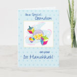 Grandson First Hanukkah Holiday Card<br><div class="desc">This colorful design on a white and blue background is perfect for a baby boy. Gold coins and toys to wish your Grandson a very happy First Hanukkah.</div>