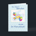 Grandson First Hanukkah Holiday Card<br><div class="desc">This colorful design on a white and blue background is perfect for a baby boy. Gold coins and toys to wish your Grandson a very happy First Hanukkah.</div>