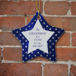 Grandson Star Pattern Keepsake Ceramic Ornament<br><div class="desc">This is a wonderful Christmas ornament for a grandparent to give to a grandson. It features a silver star shape set against a star studded blue background. In the center is your customized text in dark blue. Currently, the text says "My grandson is the star in my heart". The text...</div>