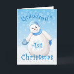 Grandson's First Christmas Snowman Greeting Card<br><div class="desc">A flurry of snowflakes surround this smiling snowman all decked out in fuzzy blue hat and mittens. A delightful Christmas design for your grandson's first Christmas greeting card. Personalize the inside verse using the template provided. I specialize in custom-made designs, contact me if you would like a unique 1st Christmas...</div>