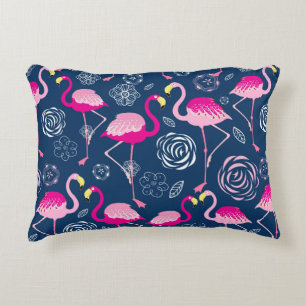 Graphic pattern of pink flamingos on a dark blue b accent pillow