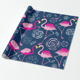 Graphic pattern of pink flamingos on a dark blue b wrapping paper