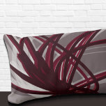 Gray and Burgundy Artistic Abstract Ribbons Lumbar Pillow<br><div class="desc">Gray and burgundy lumbar pillow features an artistic abstract ribbon composition with shades of burgundy and gray with white accents on a gray background. This abstract composition is built on combinations of repeated ribbons, which are overlapped and interlaced to form an intricate and complex abstract pattern. The gray, burgundy, white...</div>