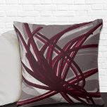 Gray and Burgundy Artistic Abstract Ribbons Throw Pillow<br><div class="desc">Gray and burgundy throw pillow features an artistic abstract ribbon composition with shades of burgundy and gray with white accents on a gray background. This abstract composition is built on combinations of repeated ribbons, which are overlapped and interlaced to form an intricate and complex abstract pattern. The gray, burgundy, white...</div>
