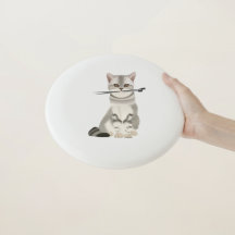 Gray and White Cat holding Knitting Needles