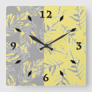 Gray and yellow leaves on a striped background. square wall clock