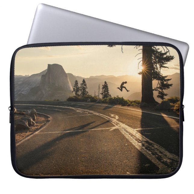 Gray asphalt road near mountain in the morning laptop sleeve (Front)