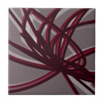 Gray & Burgundy Artistic Abstract Ribbon Ceramic Tile<br><div class="desc">Gray and burgundy ceramic tile features an artistic abstract ribbon composition with shades of burgundy wine and gray with white accents on a grey background.</div>
