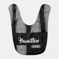 Gray camera film on black baby bib