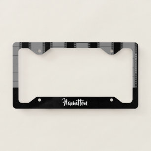 Gray camera film on black license plate frame