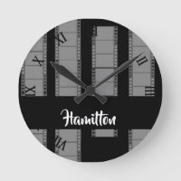 Gray camera film on black round clock
