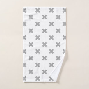 Gray cross stitches on white hand towel 